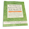 Book titled 'The Dialectical Behavior Therapy Skills Workbook' on a white background