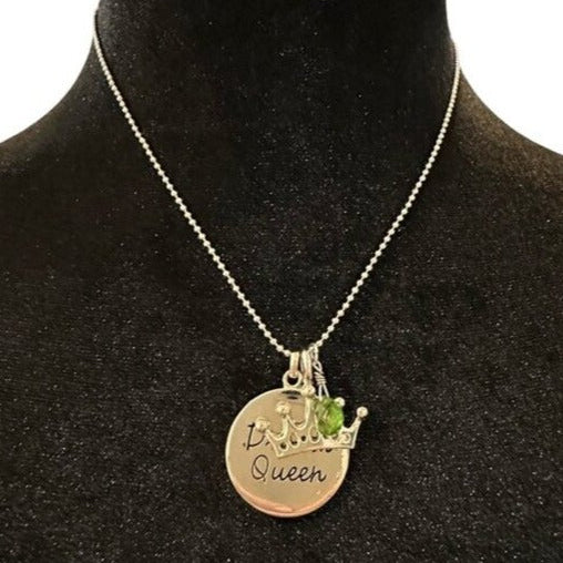 Necklace with a pendant on a black mannequin bust
