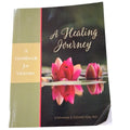 Book titled 'A Healing Journey: A Workbook for Women' by Stephanie S. Covington, PhD with pink lotus flowers on the cover.