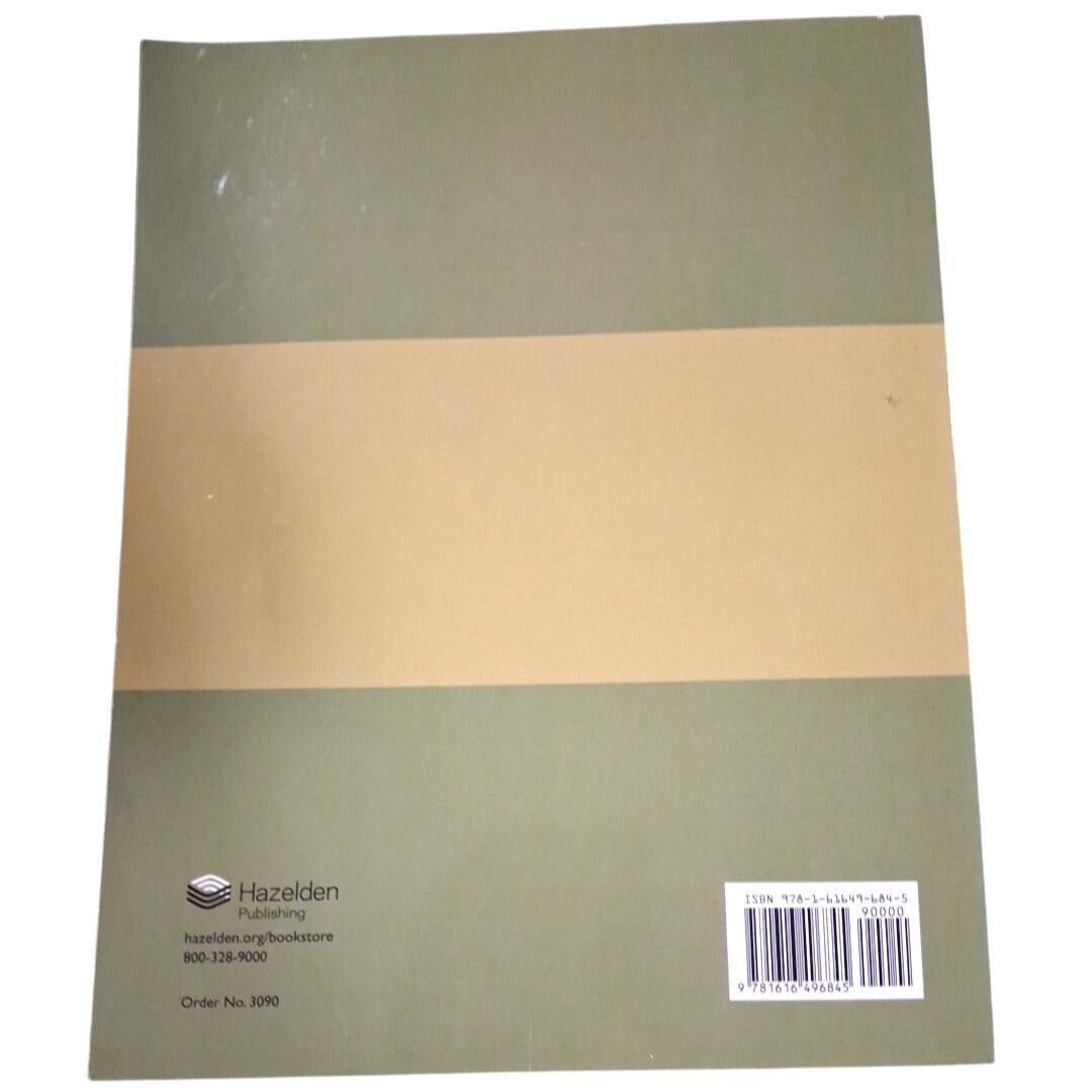Notebook with a green and beige cover and Hazelden branding on a white background