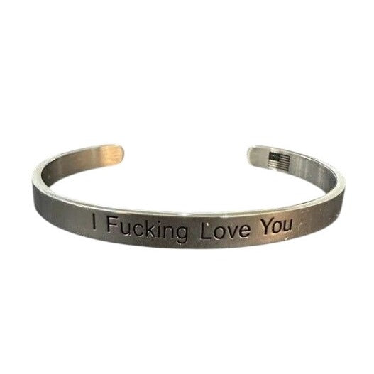 Metallic bracelet with engraved text on a white background