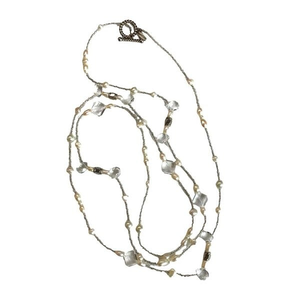 Long beaded necklace with a clasp on a white background