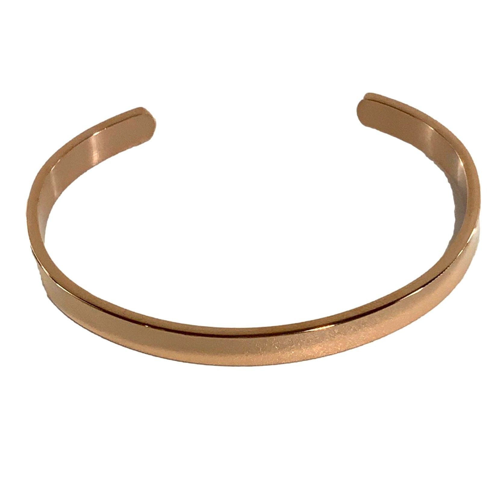 Rose gold bangle on a white background