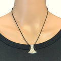 Necklace with a pendant on a mannequin wearing a black top.