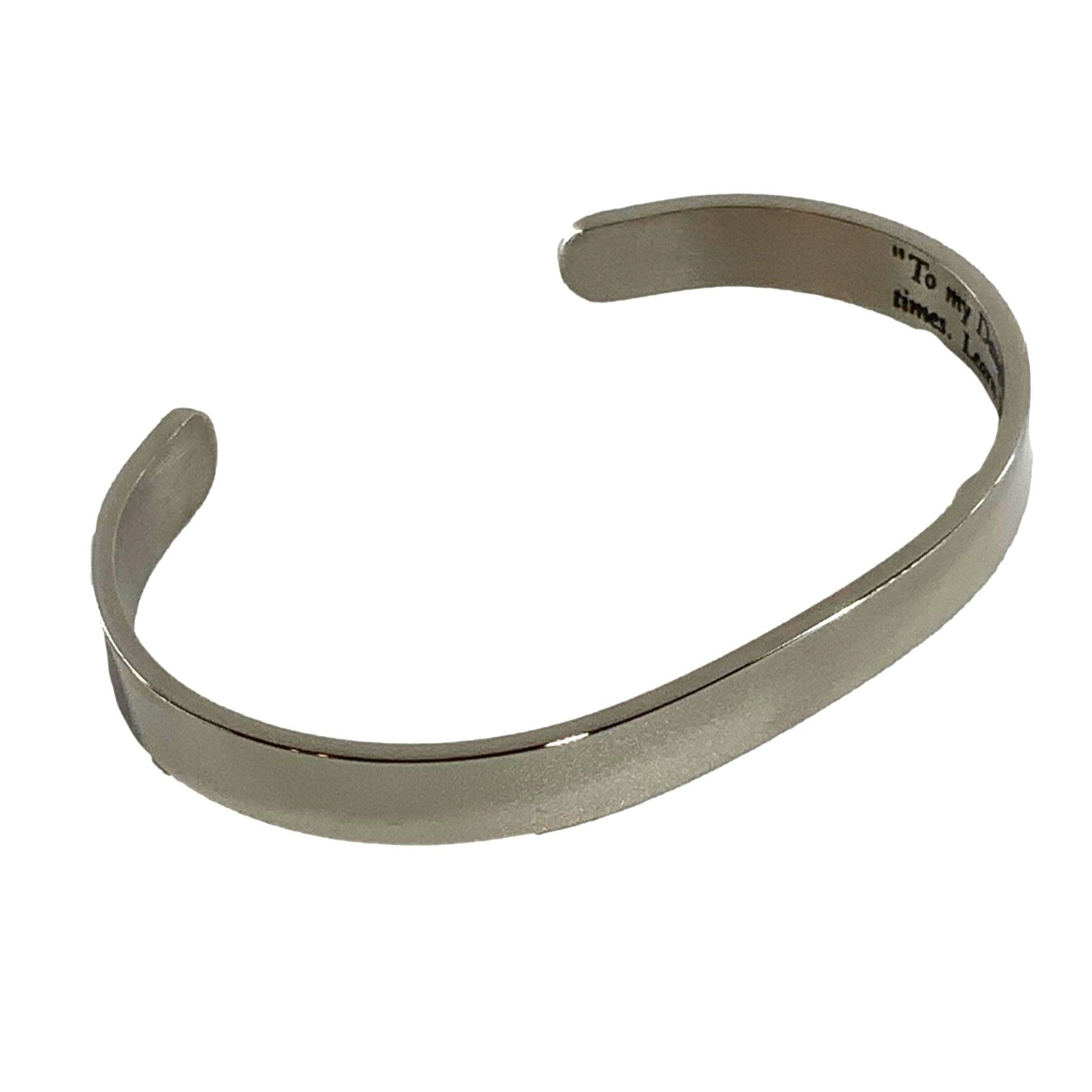 Silver bracelet with engraved text on a white background