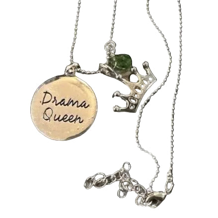 Necklace with 'Drama Queen' pendant on a black background