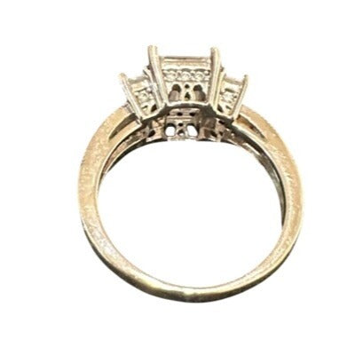 silver ring with diamond accents on a white background