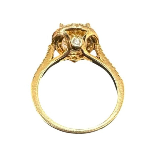 Gold ring with a diamond on a white background