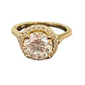 Gold ring with a gemstone on a white background