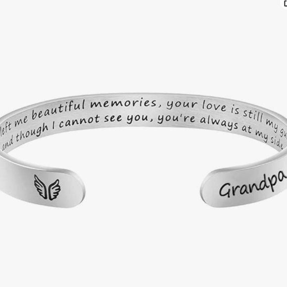 Silver bracelet with engraved message on a white background