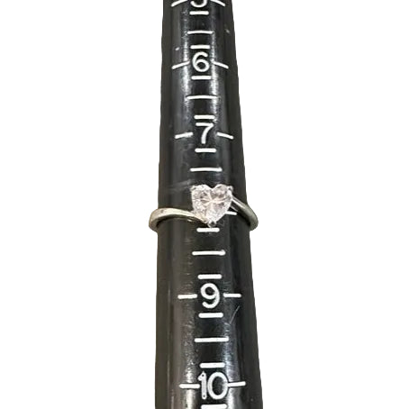 Ring on a black rod with measurement markings against a white background