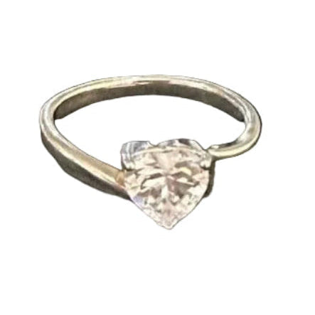 Heart-shaped diamond ring on a white background