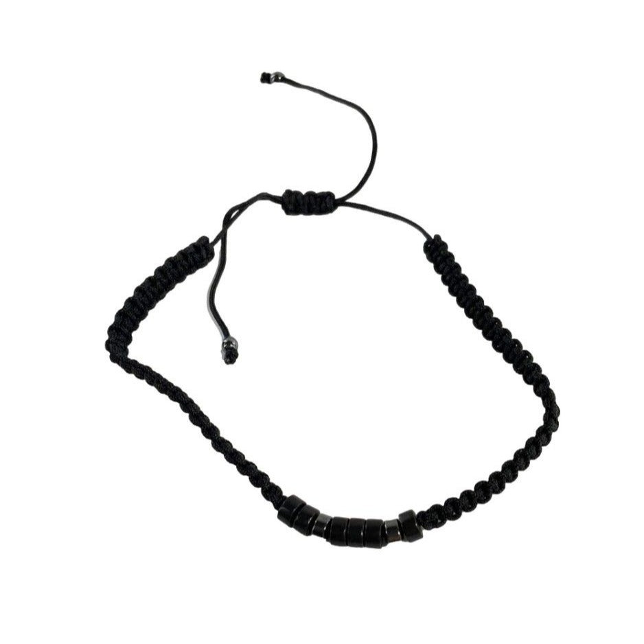 Black beaded bracelet on a white background