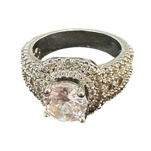 Silver ring with a gemstone on a white background