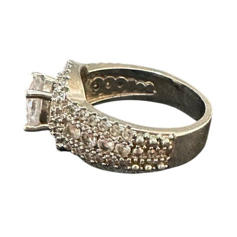 Silver ring with gemstones on a white background