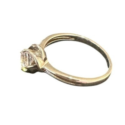 silver ring with a diamond on a white background