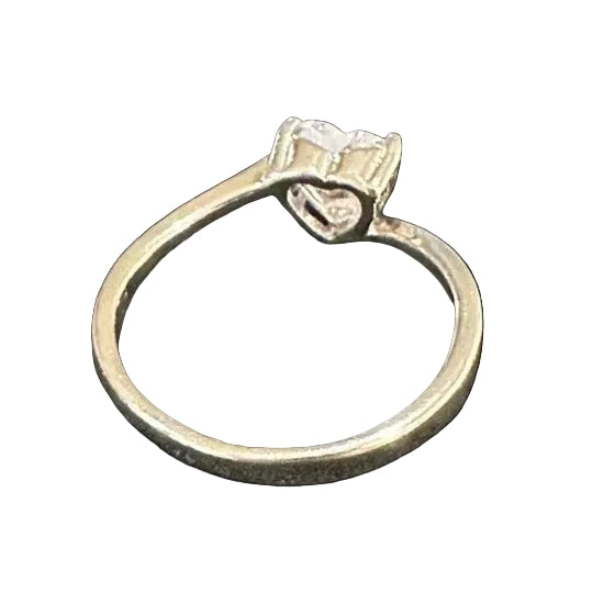 silver ring with a diamond on a white background