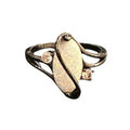 Gold ring with a central opal stone and smaller gemstones on a white background