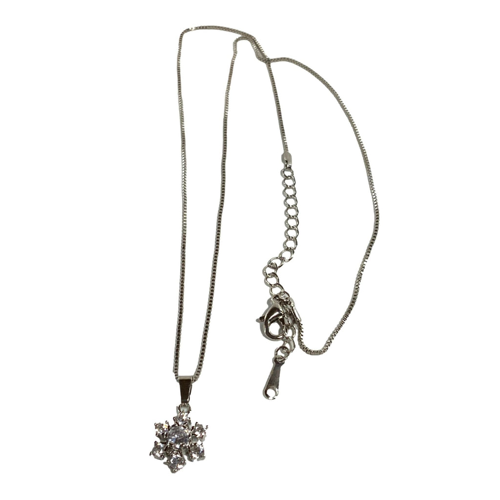 Silver necklace with a snowflake pendant on a white background