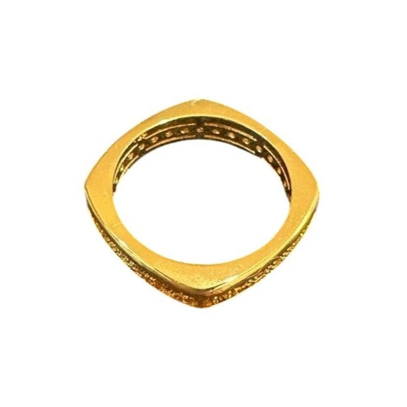 Gold ring with a textured band on a white background