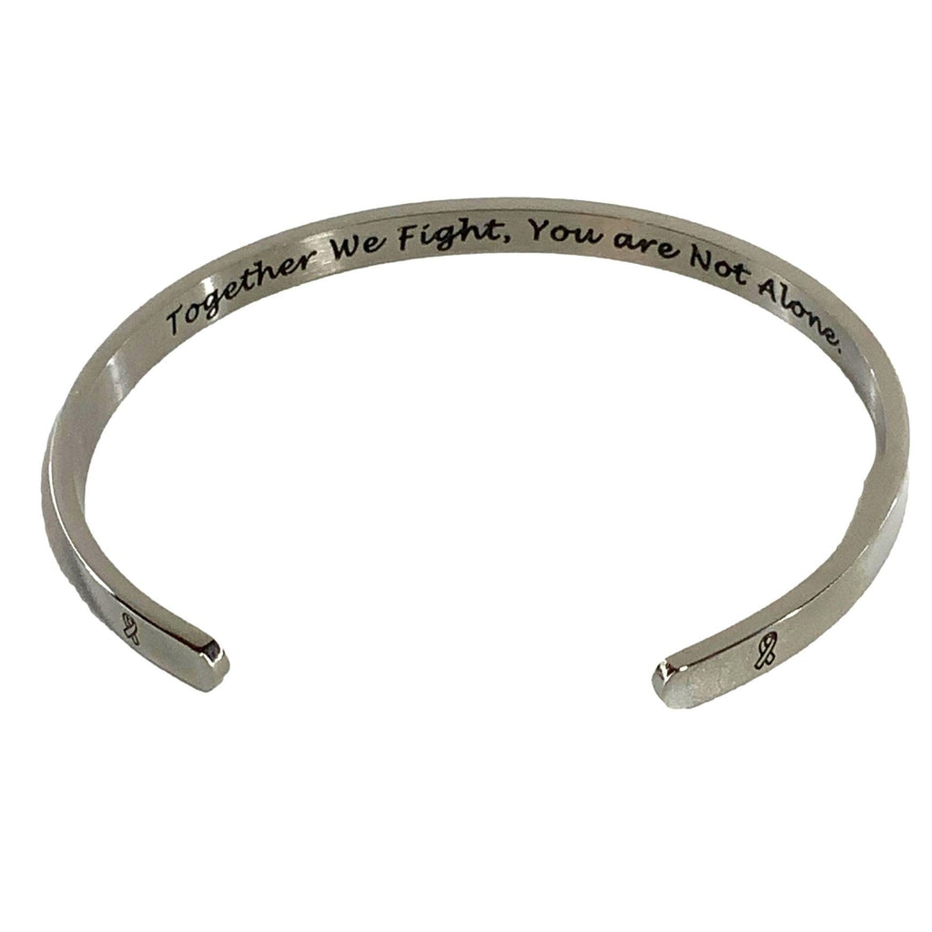 Silver bracelet with engraved text on a white background