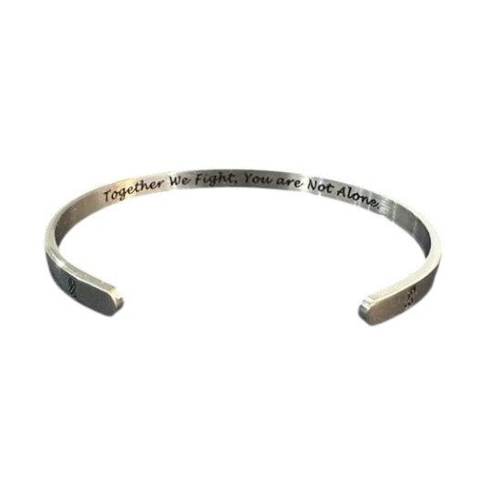 Silver bracelet with engraved text on a white background