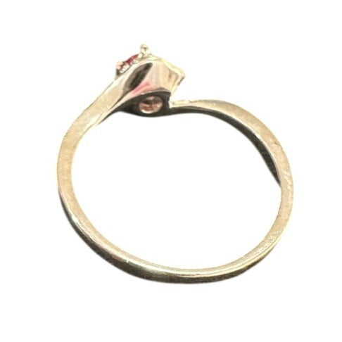Silver ring with a small gemstone on a white background