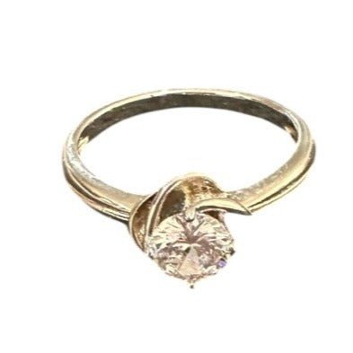 Gold ring with a gemstone on a white background